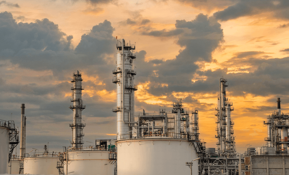 Large industrial processing facility at sunset