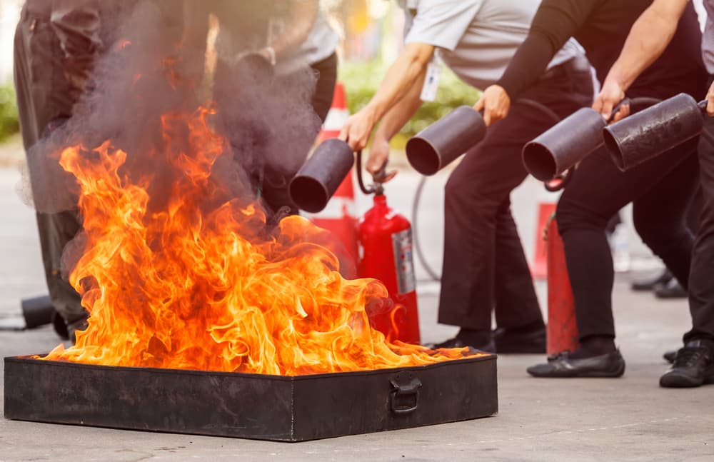 Participants completing practical fire-safety training